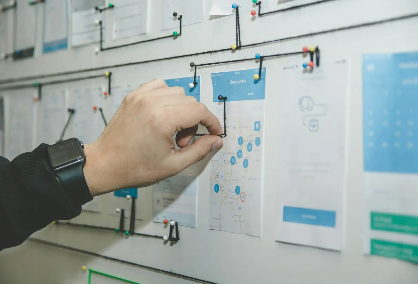 A wall of page designs being worked through
