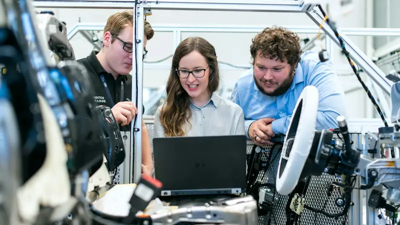 Engineers working through a build together