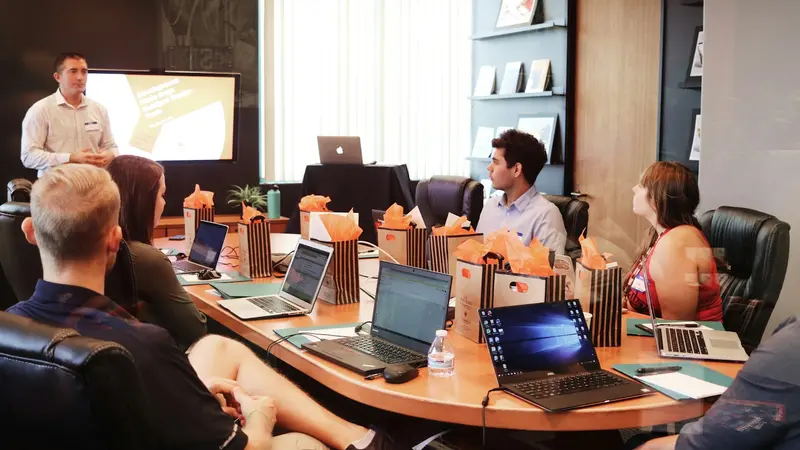 A room of people in a working session