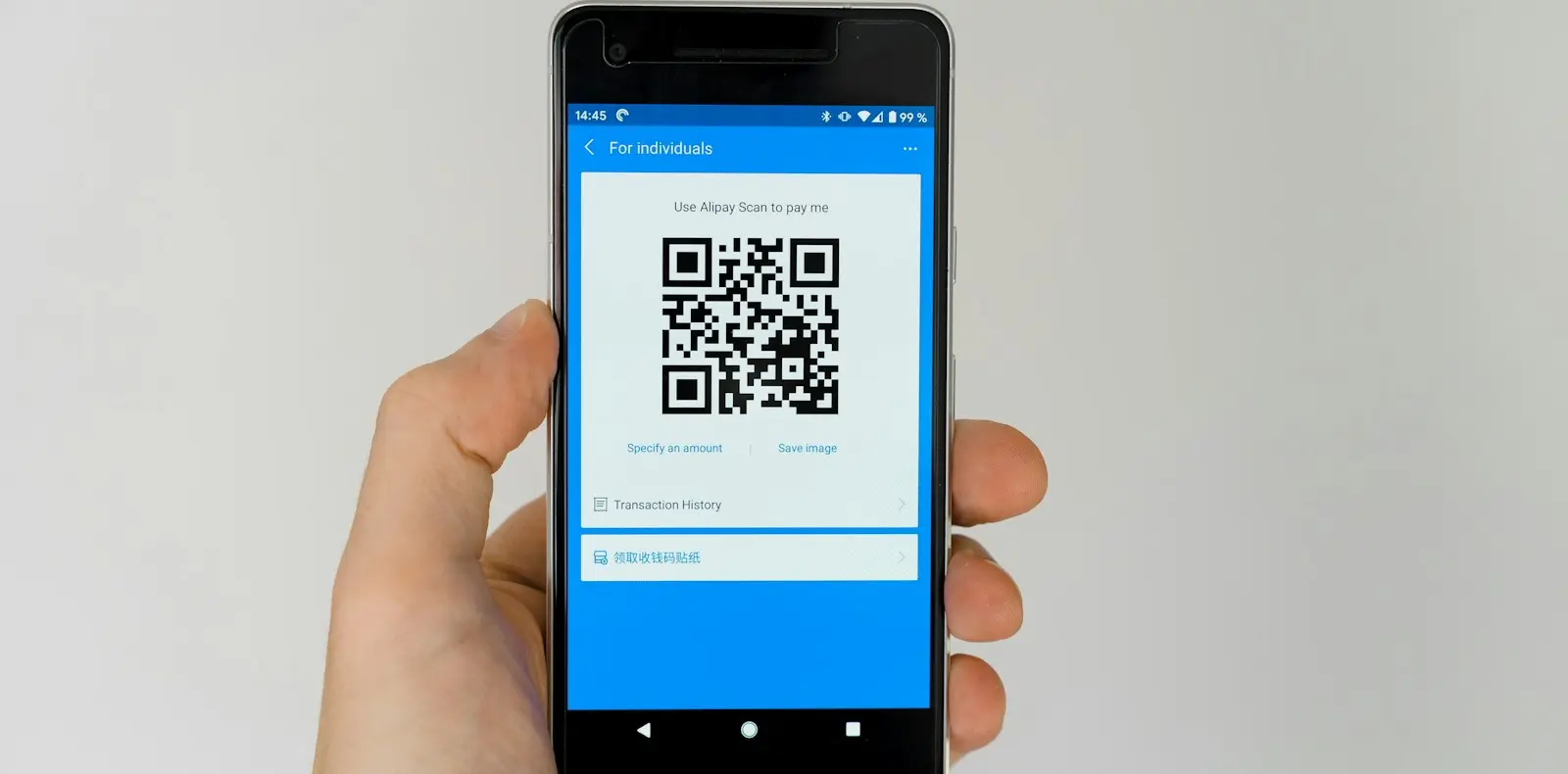 A customer paying by QR code on a phone